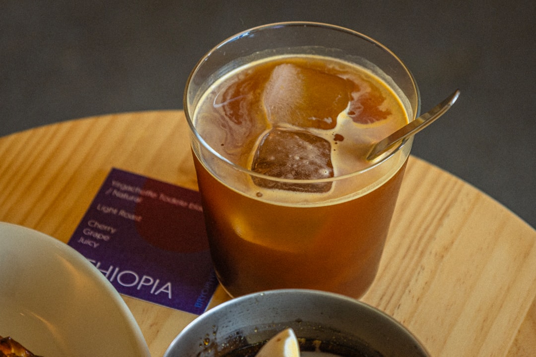 services-02 iced-coffee-with-ice-cubes-and-spoon-on-table-75qjgornrxc